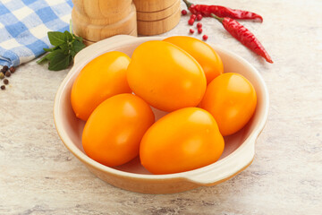 Sweet ripe yellow tomato in the bowl