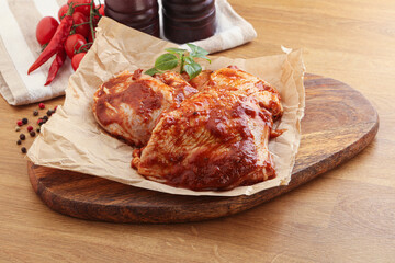 Marinated chicken leg in tomato sauce