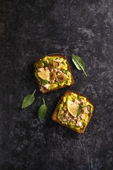 Set Tasty tuna toast. Italian bruschetta sandwiches with canned tuna,  avocado, olives, Delicious breakfast or snack. Top view.