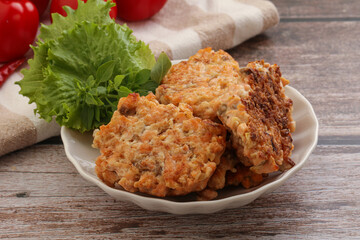 Fried salmonn cutlet in the bowl