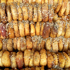 Organic dried figs with sesame top view close up, food pattern