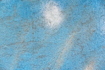 Blue and white painted wall. Texture of the exterior stone wall of the building. Abstract...