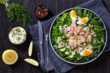 Fototapeta premium pink cocktail shrimps salad with veggies on plate