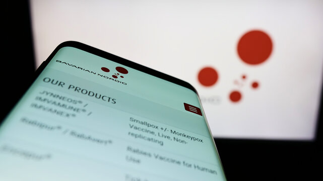 Stuttgart, Germany - 05-22-2022: Mobile phone with website of biotechnology company Bavarian Nordic AS on screen in front of business logo. Focus on top-left of phone display.