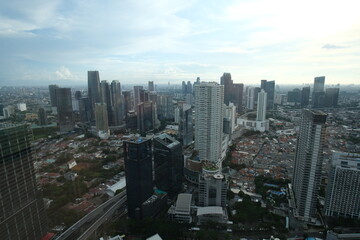 Fototapeta na wymiar Jakarta city viewed from the top and at sunset
