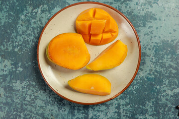 sliced mango in plate, ready to eat