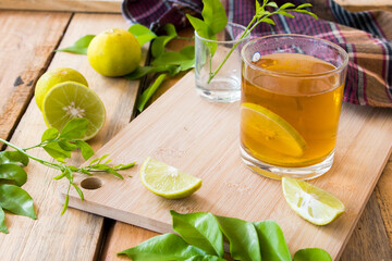 herbal healthy drinks lemon tea for health care arrangement on background wooden