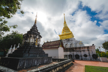 Fototapeta na wymiar The golden stupa at Wat Phra That Chang Kham Worawihan, or Phrathat Chang Kham Worawihan temple, is the one attraction and is famous in Nan province, Thailand.