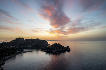 Sunrise over Isola Bella island near Taormina, Sicily, Italy.