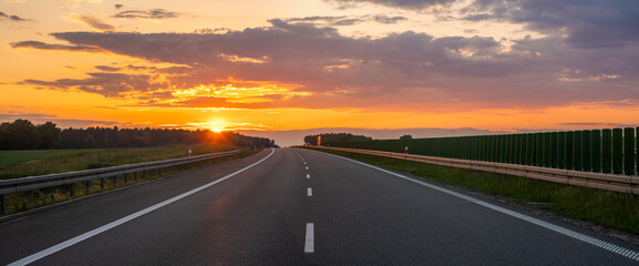 empty highway during a spectacular sunset