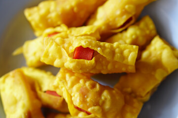 Fried dumplings wrapped in red meatballs