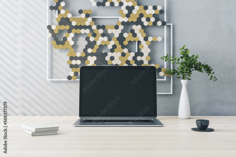 Aufkleber Close up of creative wooden designer desktop with empty computer screen and decorative banner, plant and coffee cup. Mock up and 3D Rendering concept.