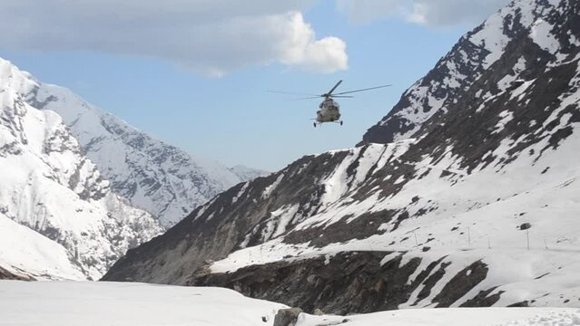 Indian air force Helicopter MI 26 landing on snow field in Himalayas. ,during heavy snowfall in Kedarnath of India. Its a risky work to do in this type of Climate. High quality Full HD footage
