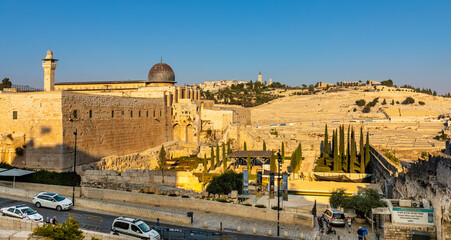 Fototapeta premium Panorama of Mount of Olives over south wall of Temple Mount and Al Aqsa mosque and Dung Gate in Jerusalem Old City in Israel