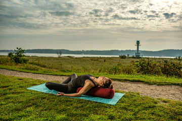 exercising yoga the beach 