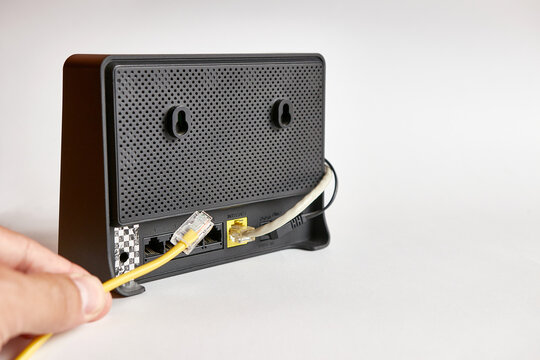 A network cable for connecting to the Internet is connected to the router.