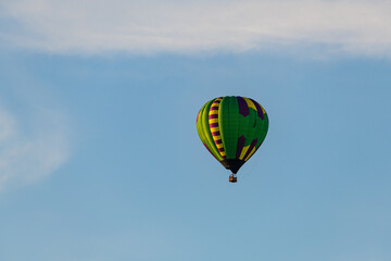 Naklejka premium Hot air balloons floating in the air over the City of Burlington, WI