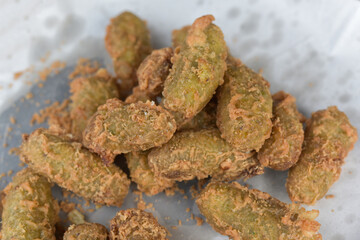 Thai dessert called Khao Mao Tod Deep-fried Bananas with Coconut.