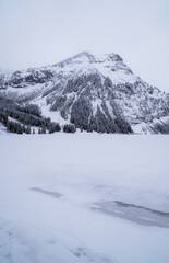 Vertical view of the frozen Visalpsee near Tannheim, Austria