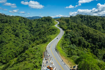 The zigzag road is similar to the number 3. This road is built on a mountain, past the forest in...