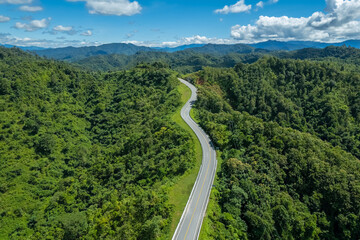 Fototapeta premium The zigzag road is similar to the number 3. This road is built on a mountain, past the forest in Nan, Thailand, so it will have good scenery, be famous, and have tourists who come to take pictures.