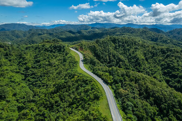 The zigzag road is similar to the number 3. This road is built on a mountain, past the forest in...