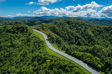 The zigzag road is similar to the number 3. This road is built on a mountain, past the forest in...