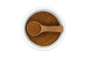 Coconut palm sugar in a bowl isolated on white. Top view. Brown coconut palm sugar. 