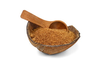 Sweet coconut sugar in coconut shell with wooden spoon isolated  on white background. © Sanja