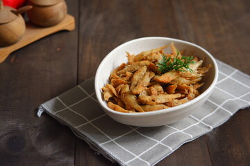 a plate of fried crispy fish on the table 