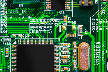 Close up of components and microchips on PC circuit board.