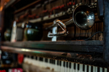 Fototapeta na wymiar Room decor with vintage trumpet and piano