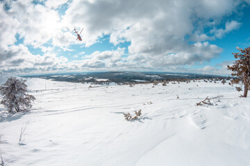 Helicopter flying in the Finnish mountains, Levi Lapland