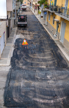 Bari, ITALY - March 29, 2022: urban street ready for asphalt resurfacing. The deteriorated asphalt was previously milled.