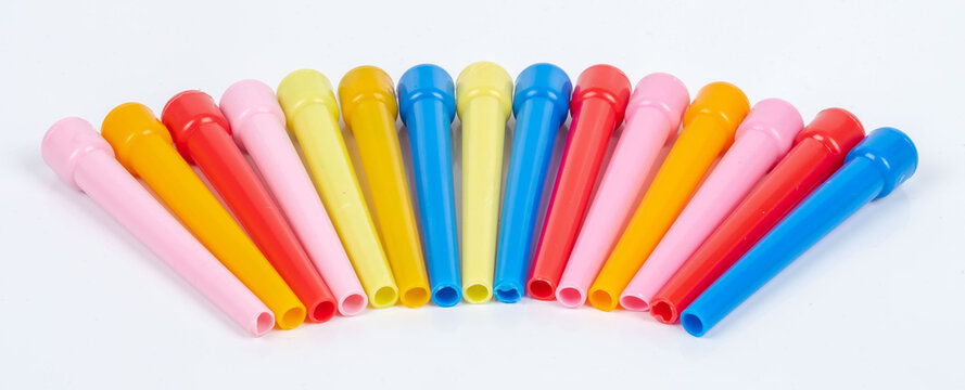 Colored plastic hookah mouth tips, standing in an isolated private environment, accessories on a white background
