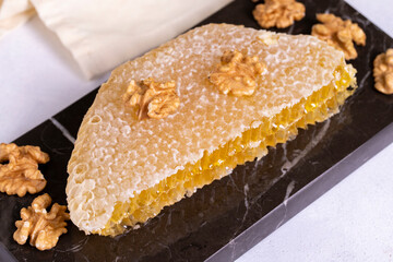 Honey. Honeycomb on white background. Fresh organic honey comb on marble. close up
