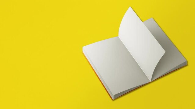 Seamless loop video. Book page flipping on yellow background. Concept of stationery, books, back to school, school themes, simple background, poster, book festival, university, educational.