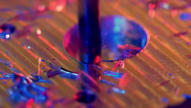 CNC machining of a hole in metal, macro slow motion shot