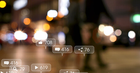 Image of social media icons and numbers over out of focus traffic lights