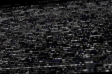 Black and white code background. compressed website javascript code
