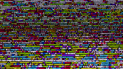Colorful code background. compressed javascript code on computer screen. Software developer coding screen