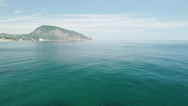 Gurzuf resort city panoramic view on Bear Mountain, Ayu-Dag, Yalta, Crimea. Spring sunny day. Nature summer ocean sea beach background. Vacation, travel and holiday concept.