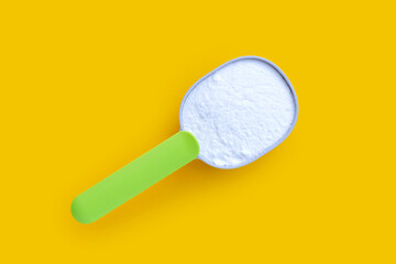 Baking soda on yellow background.