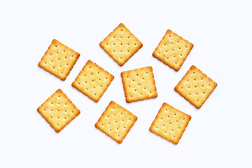 Dry cracker cookies on white background.