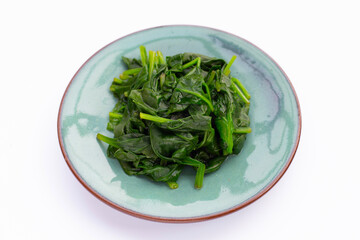 Boiled spinach on white background.