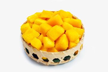 Tropical fruit, Mango cube slices in bamboo basket on white background.