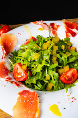Rocket salad with dried Spanish ham