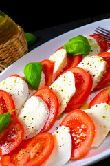 Tomato with mozzarella and basil