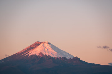 Fototapeta na wymiar Last light on Cotopaxi volcano at sunset, Andes mountains, Ecuador