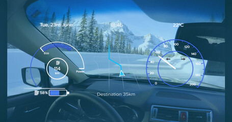 Image of speedometer, gps and charge data on interface, over car interior in winter landscape